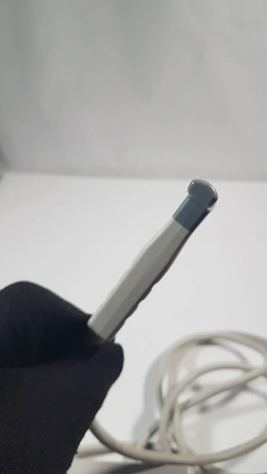 Philips l15-7io linear array ultrasound transducer probe with silver and gray metallic stylus and textured rounded tip