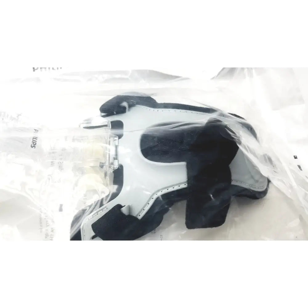 Black and white orthopedic knee brace with adjustable straps philips m af531 af531 ee leak reuse medical use