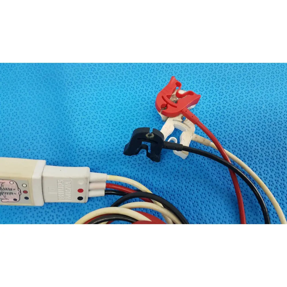 Red and black insulated wires connected to a white philips m1671a ecg leadset with red and black indicator lights