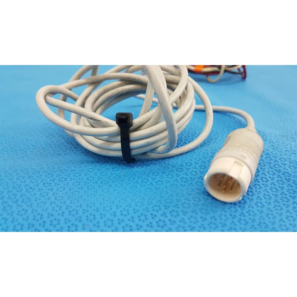Coiled white medical-grade ecg leadset cable with ribbed connector and black zip tie philips m1671a patient cable