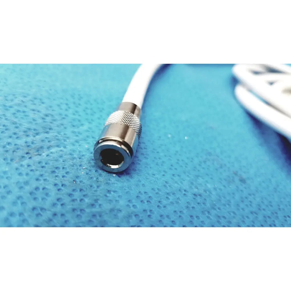 Silver-colored metallic connector with knurled texture and white cable attached for philips nibp air hose m1599b adult
