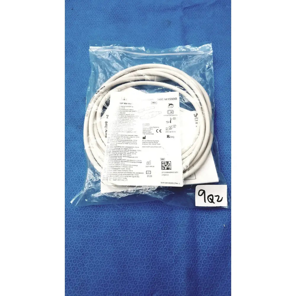 White coiled ethernet cable in clear plastic packaging with label and qr code for philips air hose m1599b adult size replacement