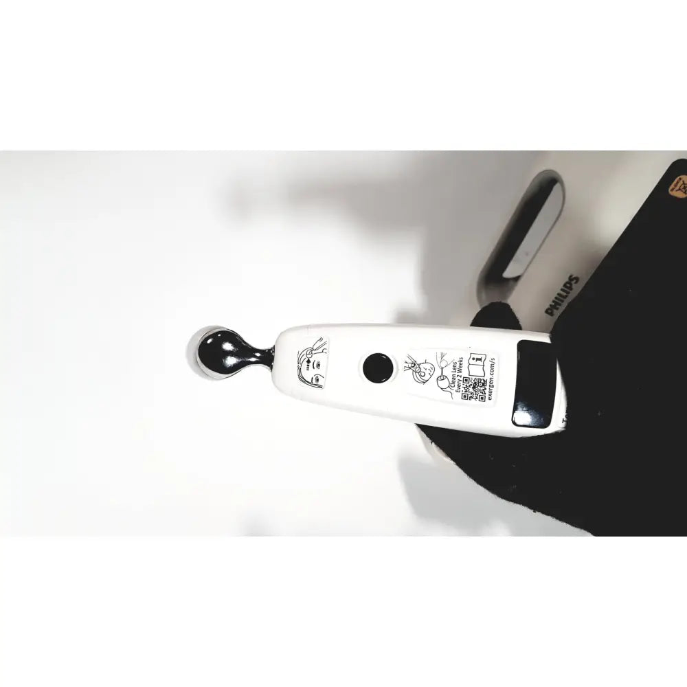White philips suresigns vs4 patient monitor facial device with black spherical tip and instructional icons on its body
