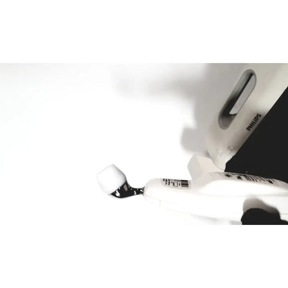 White philips steam iron with sleek modern design and black handle accents in a philips suresigns vs4 patient monitor setting
