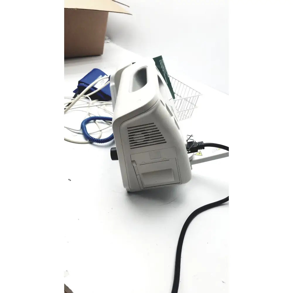 Gray plastic philips suresigns vs4 vital signs monitor back side with handle ventilation slits and attached power cord