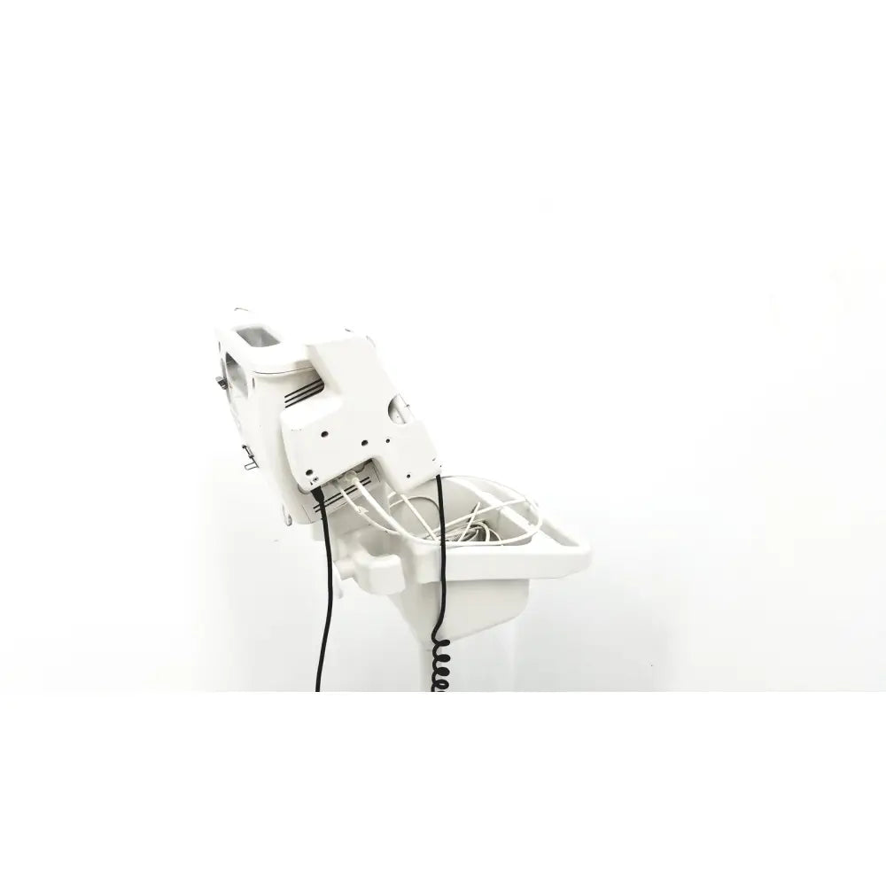White plastic salon chair with adjustable headrest and coiled power cord for Philips SureSigns VS4 vital signs monitor
