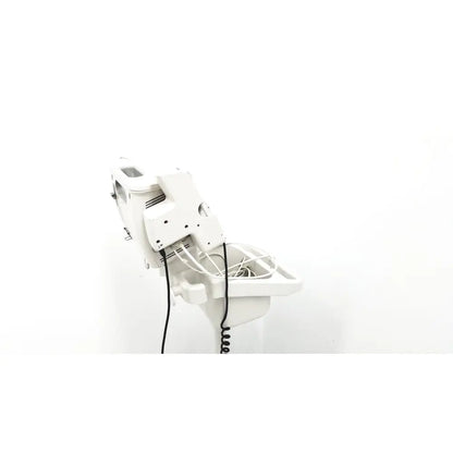 White plastic salon chair with adjustable headrest and coiled power cord for Philips SureSigns VS4 vital signs monitor