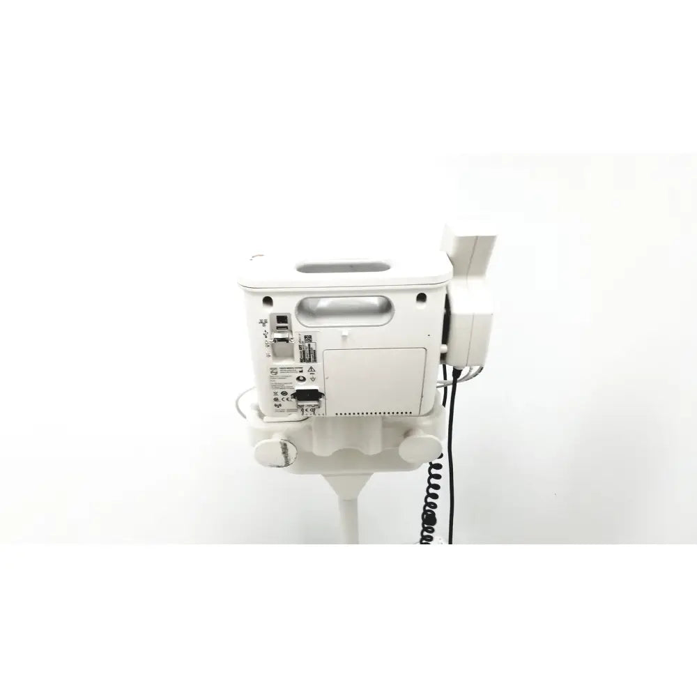 White philips suresigns vs4 vital signs infusion pump back with coiled black cable and multiple ports on panel