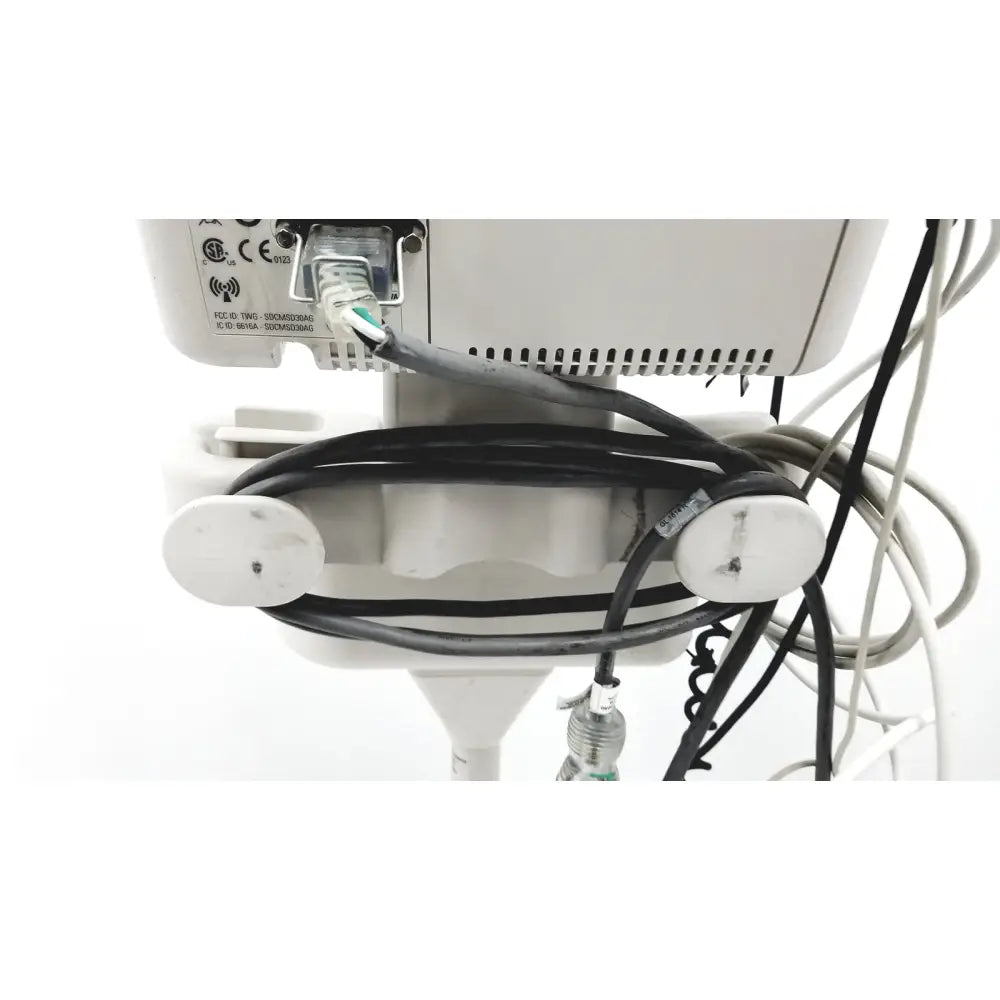 White philips suresigns vs4 vital medical device with black coiled cables and green ethernet port visible on back side