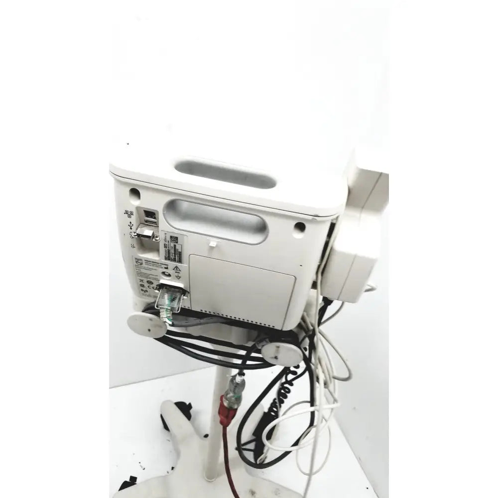 White philips suresigns vs4 vital medical monitor back with multiple ports handle and connected cables for patient monitoring