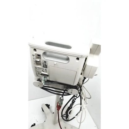 White philips suresigns vs4 vital medical monitor back with multiple ports handle and connected cables for patient monitoring