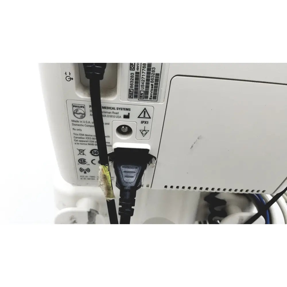 White philips suresigns vs4 vital signs device with black power cords connected to its back panel on rolling stand