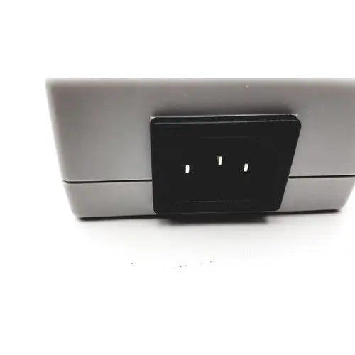 Gray rectangular philips tectrol tc21m-1402 patient monitor medical power supply with black three-slot plug insert