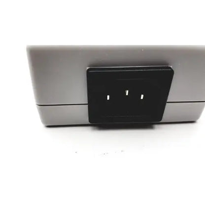 Gray rectangular philips tectrol tc21m-1402 patient monitor medical power supply with black three-slot plug insert