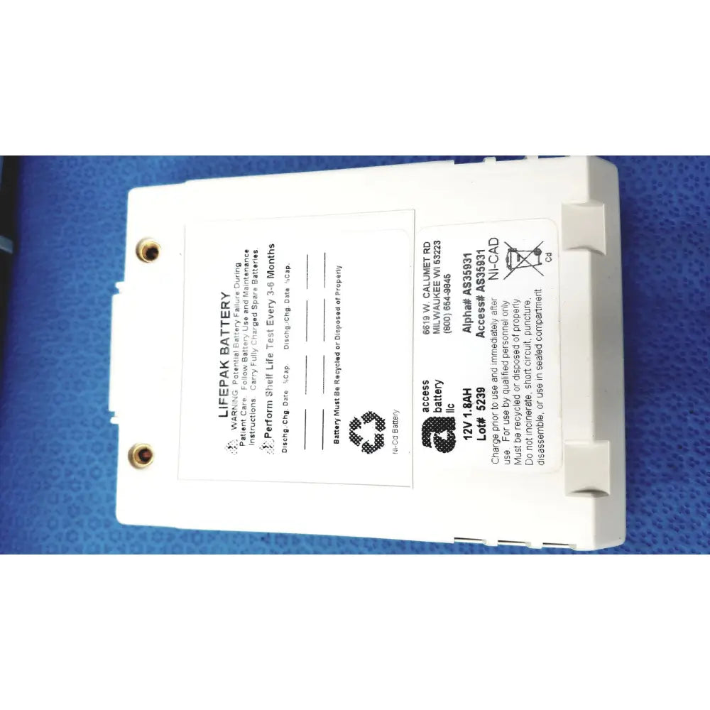 White rectangular physio control lifepak 12v 1.8ah ni-cad battery with gold terminals and safety instructions for cardiac monitor