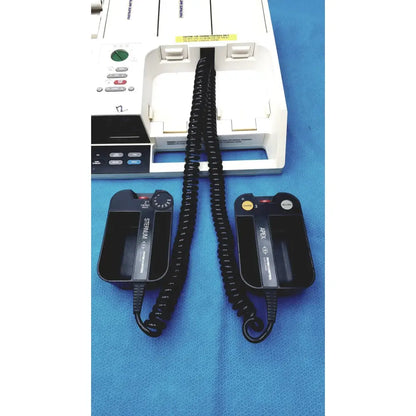 Black coiled cable connecting black sternum and abex 1d defibrillator pads on physio control lifepak 10 cardiac monitor