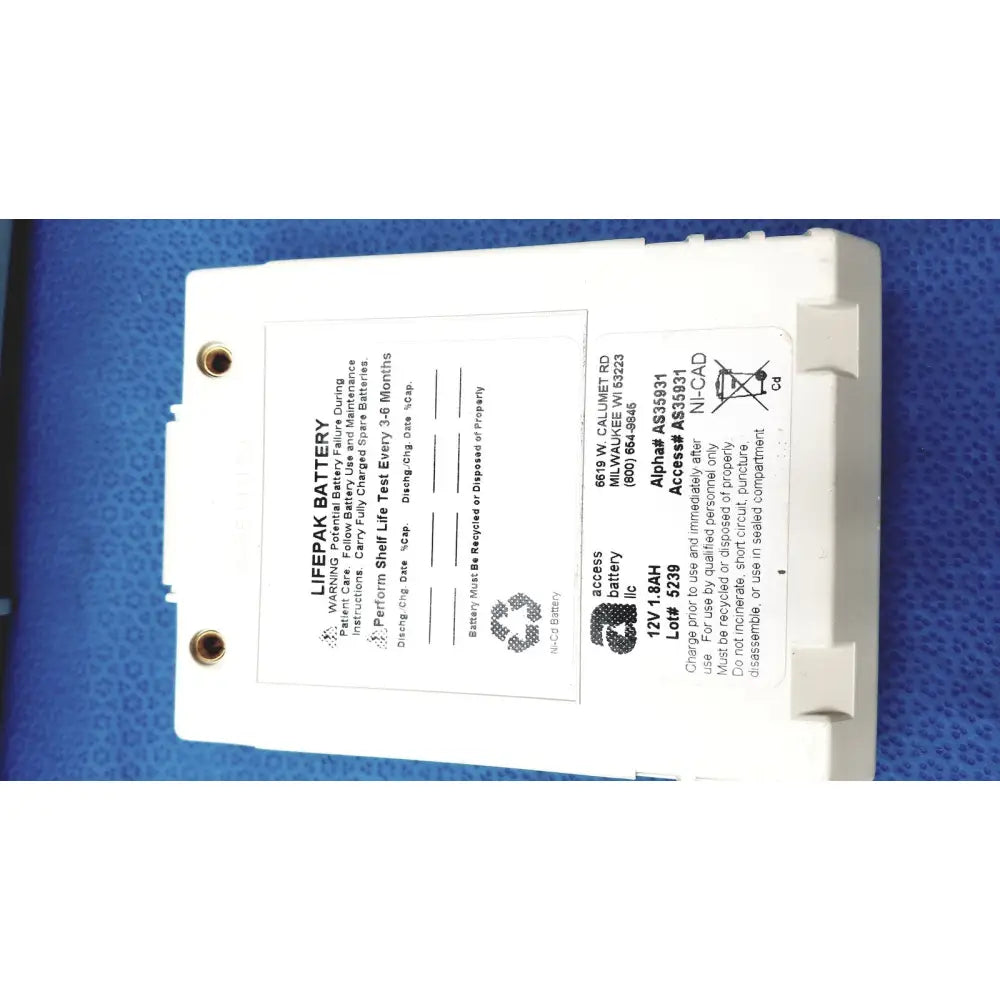 White rectangular physio control lifepak battery with label and two circular mounting holes for cardiac monitor use
