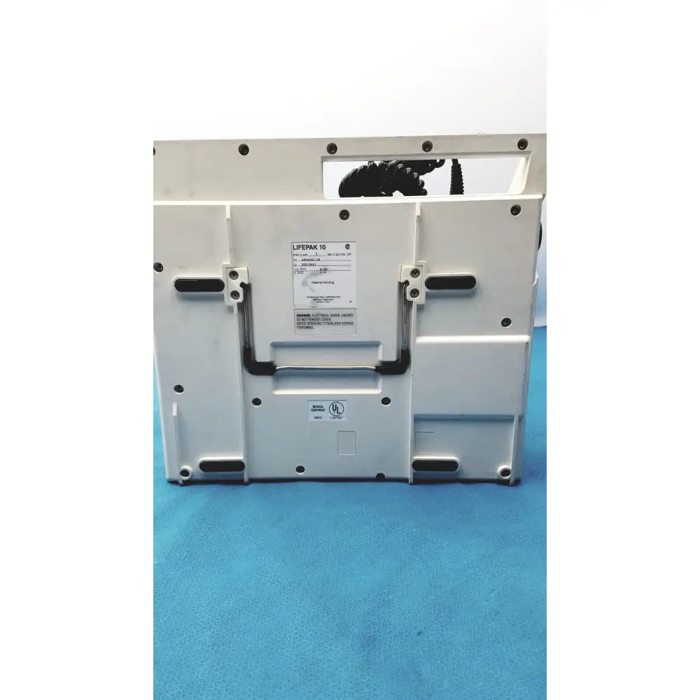White physio control lifepak 10 cardiac monitor defibrillator with black accents and model label visible