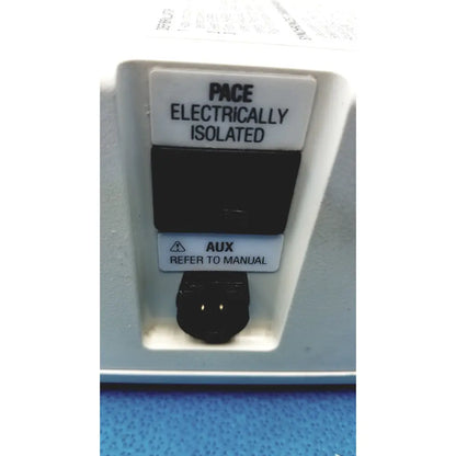 White plastic physio control lifepak 10 cardiac monitor back with black electrical ports labeled pace electrically isolated and aux refer to manual