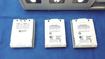 Three white physio control lifepak battery packs with printed specifications and recycling symbols for lifepak 10 monitor