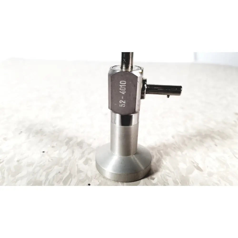 Silver metallic coffee tamper with hexagonal head engraved 52-4010 and flat base for pilling 50-4010 90 degree arthroscope reuse medical use