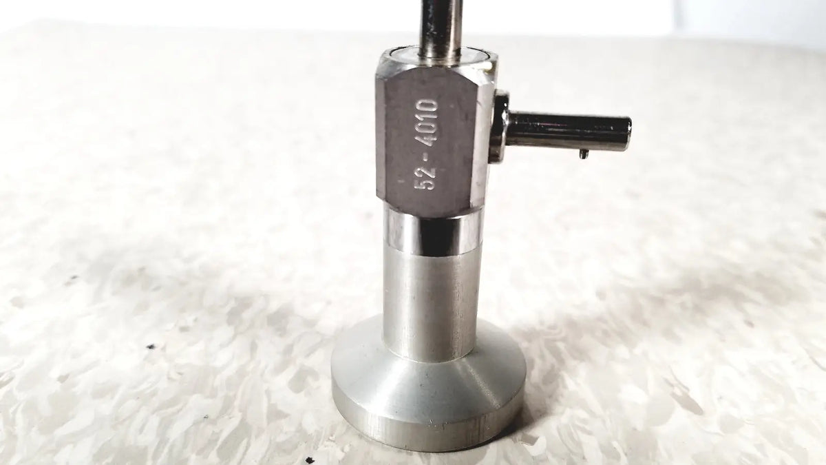 Silver metallic coffee tamper with hexagonal head engraved 52-4010 and flat base for pilling 50-4010 90 degree arthroscope reuse medical use