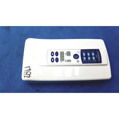 White rectangular planmeca intra x-ray control pad with blue digital display and buttons branded planica
