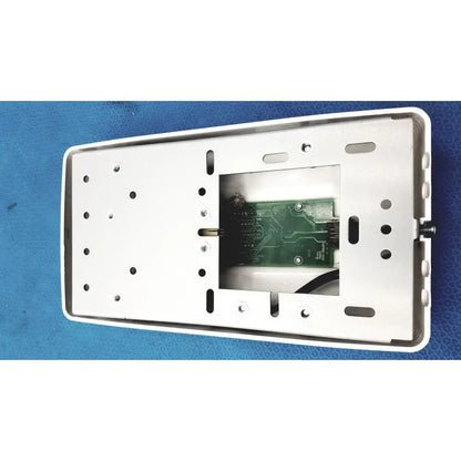 White rectangular wall-mounted control pad housing with green circuit board inside for planmeca intra x-ray system