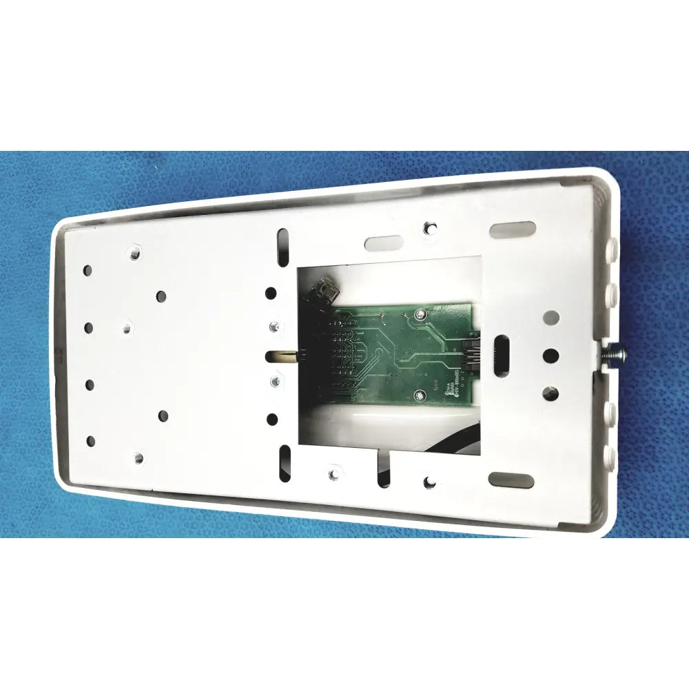 White plastic wall-mounted housing with visible green circuit board for planmeca intra x-ray control pad backside view