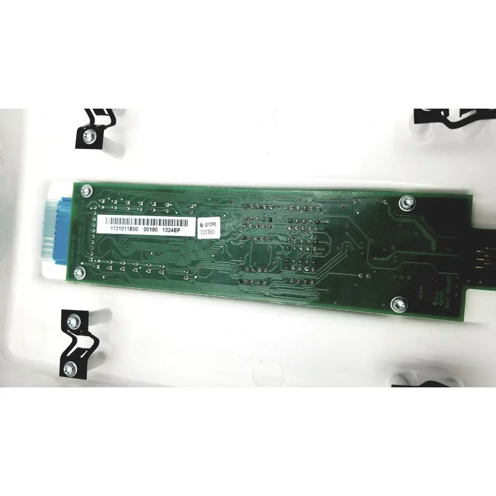 Green rectangular circuit board with silver screws and blue connector of planmeca intra x-ray control pad back side