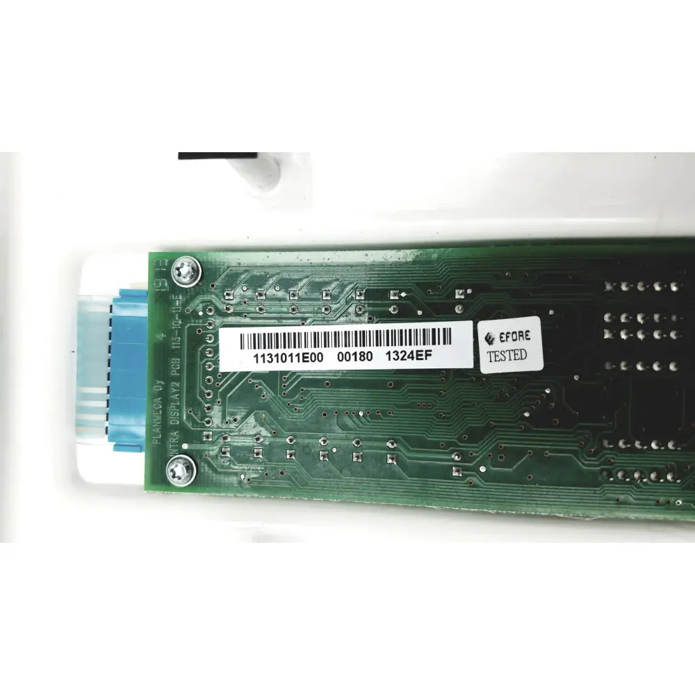 Green circuit board with barcode and before tested sticker on the back of planmeca intra x-ray control pad