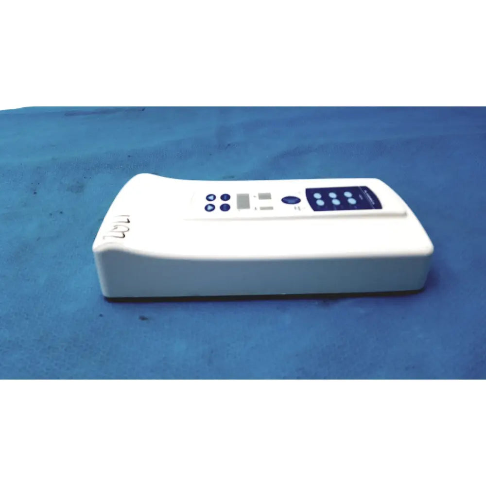 White rectangular Planmeca intra x-ray control pad with blue control panel and buttons for precise device operation