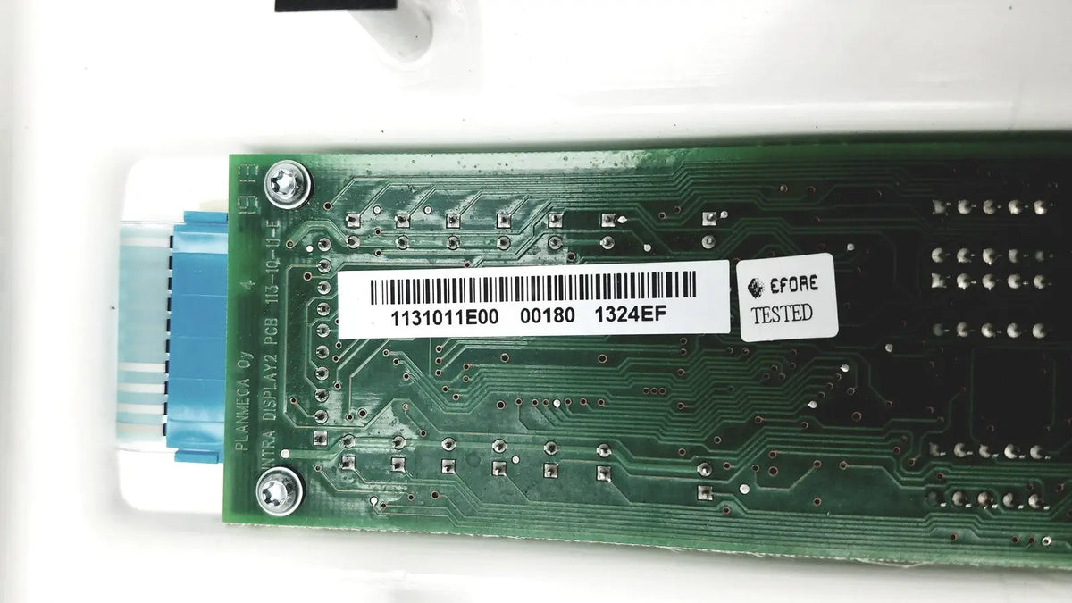 Green circuit board with barcode and before tested sticker on the back of planmeca intra x-ray control pad