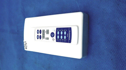 White rectangular planmeca intra x-ray control pad with blue digital display panel branded planmeca on front