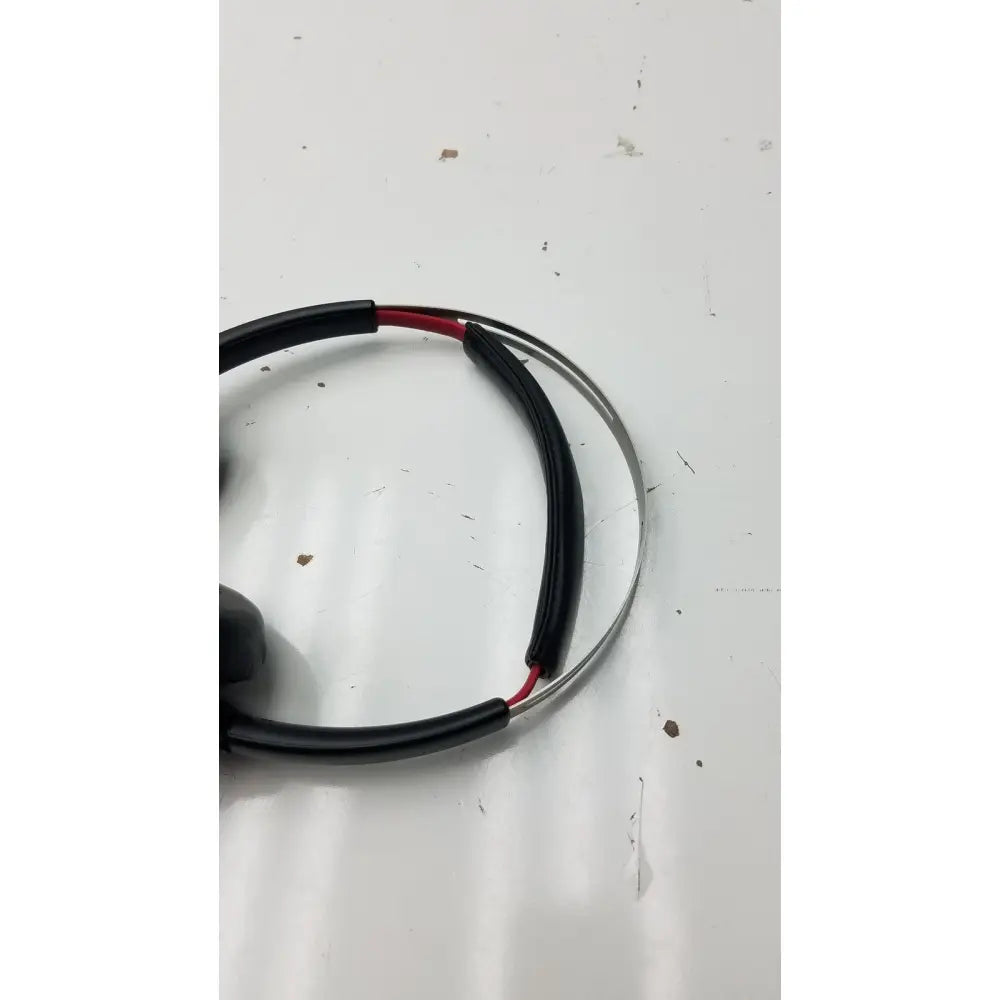 Black and red insulated wire with metallic ring connector featured in plantronics voyager focus b825 bluetooth headphones accessory