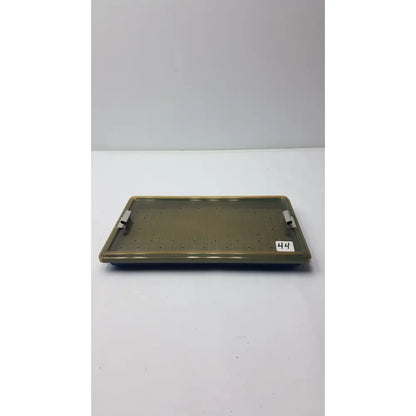 Olive-green plastic sterilization tray with silicone finger mat perforated surface and two metallic side handles
