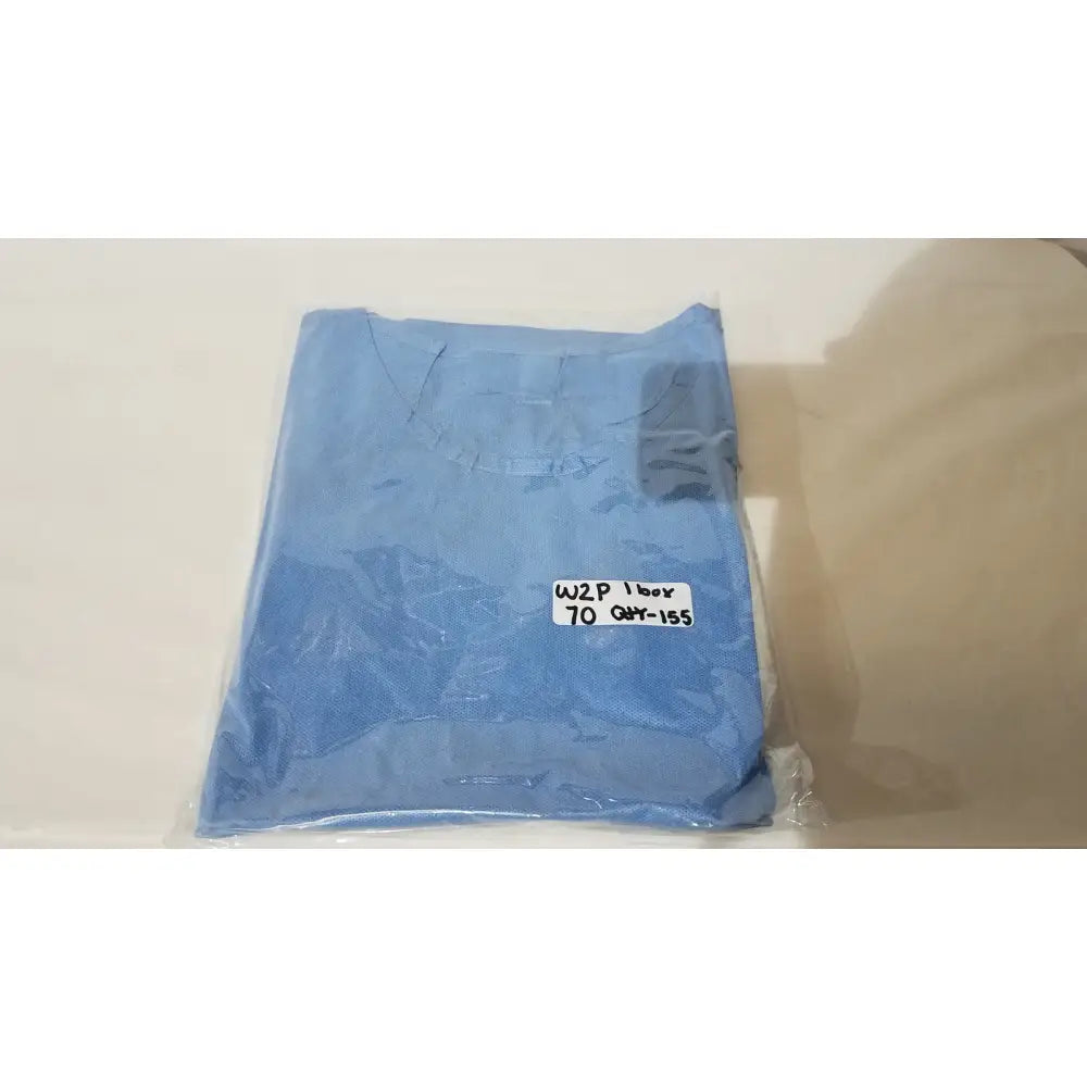 A neatly folded light blue pod disposable isolation gown packaged in clear plastic with a white label for single use