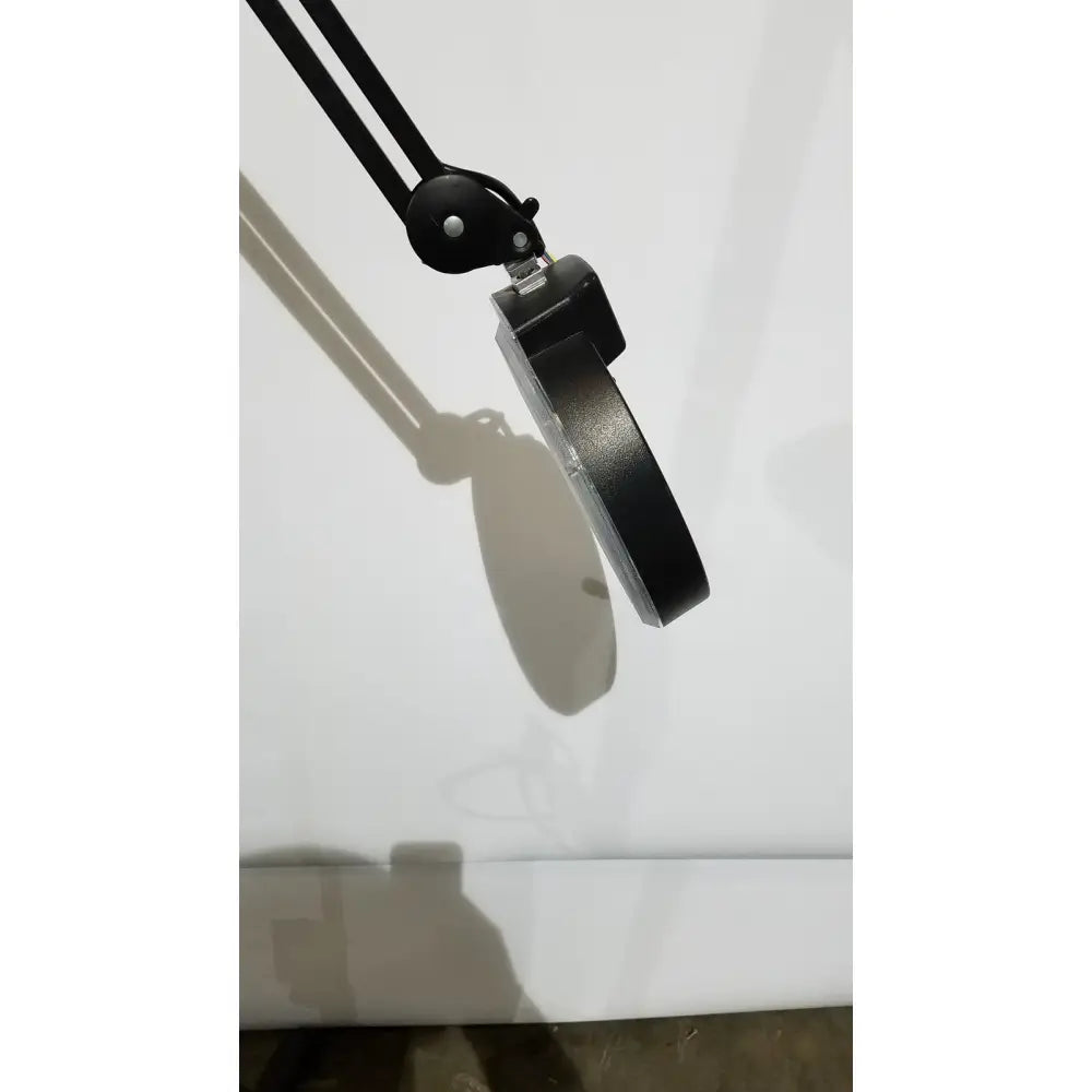 Black adjustable arm desk lamp with circular magnifying lens and metallic accents light lamp ac110v 60hz with rolling stand
