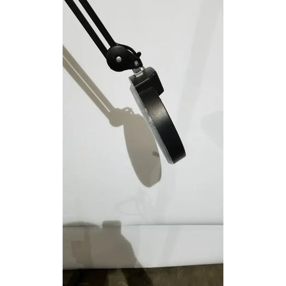 Black adjustable arm desk lamp with circular magnifying lens and metallic accents light lamp ac110v 60hz with rolling stand