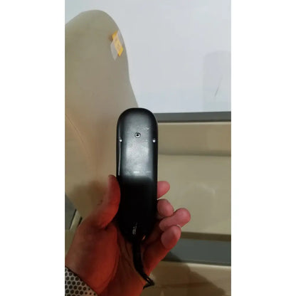 Black plastic hand control with circular button and screws on the back side of power recovery recliner model 230925-0352-02