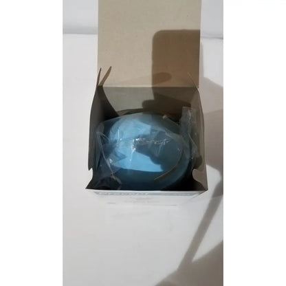 A blue oval soap bar wrapped in clear plastic inside an open box for precept cone-style face mask general use