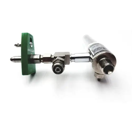 Metallic precision medical regulator with green plastic mounting bracket and silver-colored medical regulator gauge fittings