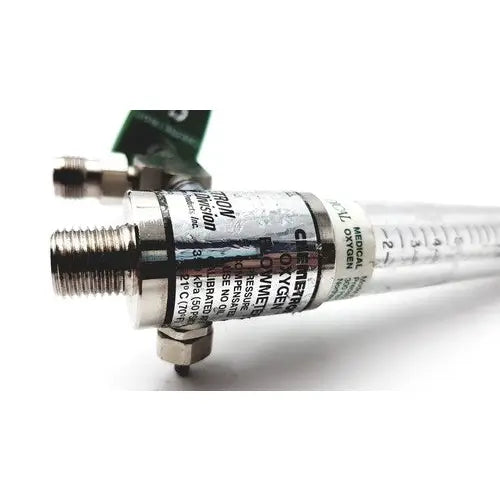 Silver-colored precision medical regulator flowmeter with clear tubing and black labeling for medical regulator gauge use