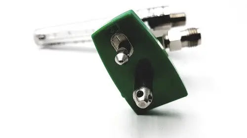Green plastic lock with metallic silver bolts and fittings for precision medical regulator gauge and clamp use