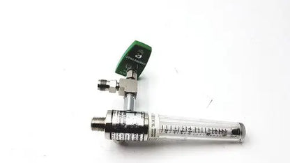 Green and silver precision medical regulator gauge with clear glass flow meter and measurement markings for oxygen control