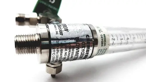 Silver-colored precision medical regulator flowmeter with clear tubing and black labeling for medical regulator gauge use