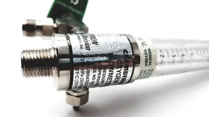 Silver-colored precision medical regulator flowmeter with clear tubing and black labeling for medical regulator gauge use