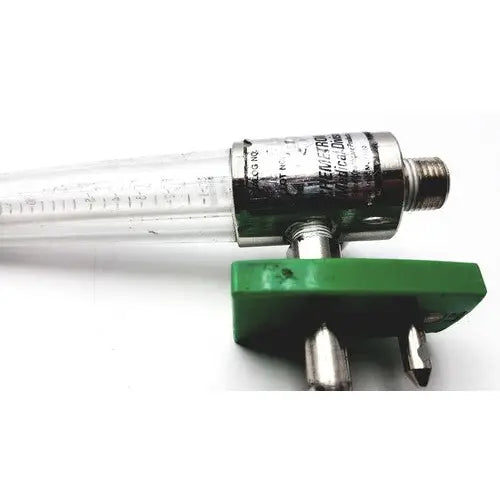 Clear glass tube with metallic threaded end and green connector for a precision medical regulator gauge