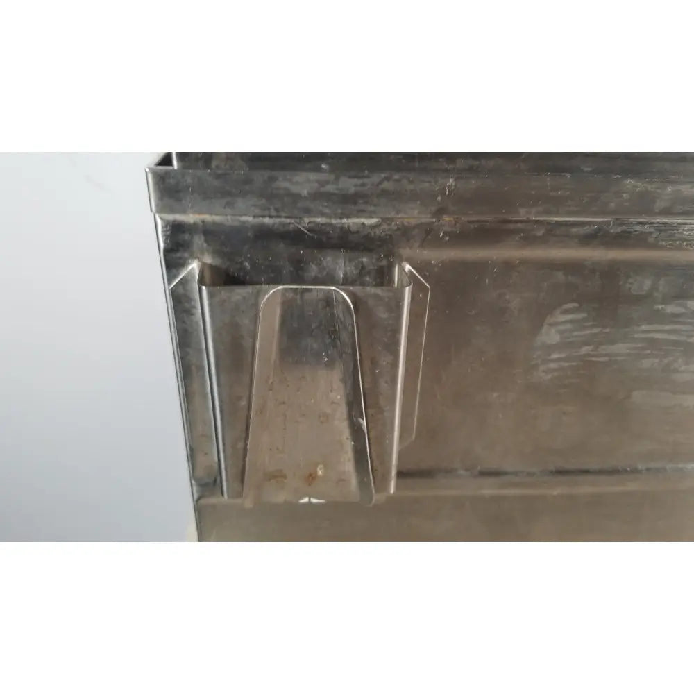 A weathered metallic precision scientific metabolic shaking incubator bin with a sturdy rectangular design and signs of wear