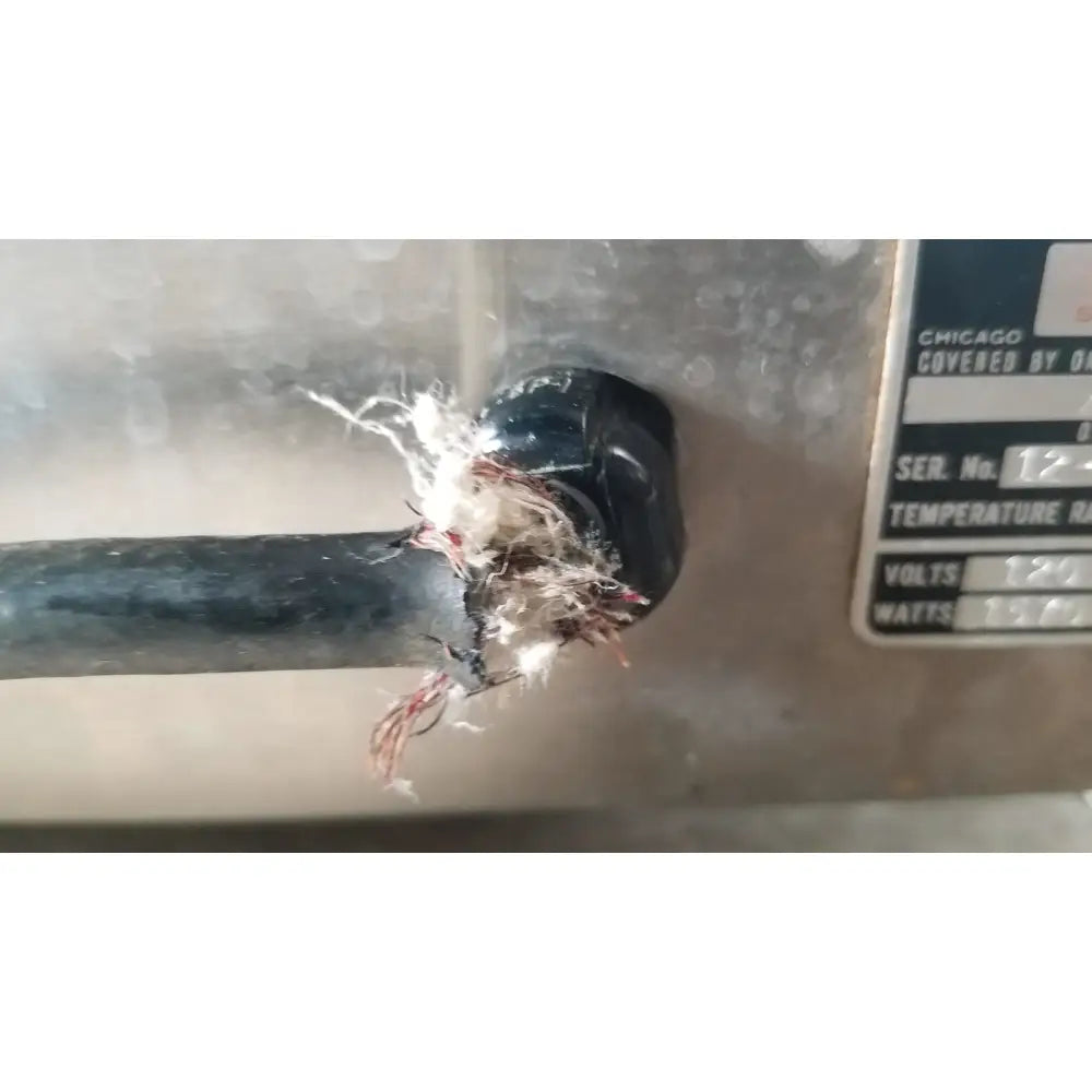 Black frayed electrical cable with exposed red and white wires at the back of precision scientific metabolic shaking incubator 66722